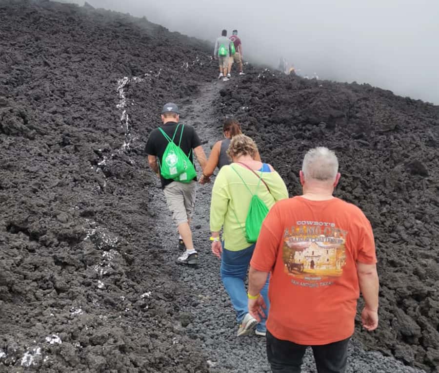 Antigua: Pacaya Volcano ATV Tour - Walking across lava rock near the 2021 eruption