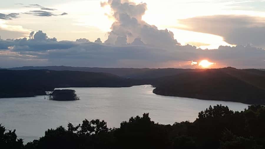 Flores: Yaxha Shared Sunset Tour with Transportation & Guide - Walking through the ruins and forest