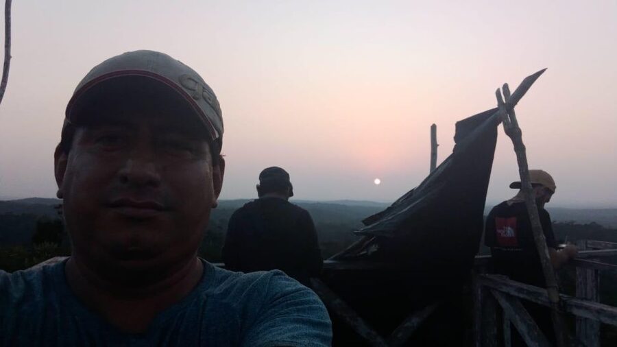 From Flores: Tikal Sunrise Archaeological Tour - Walking to Temple IV before daylight